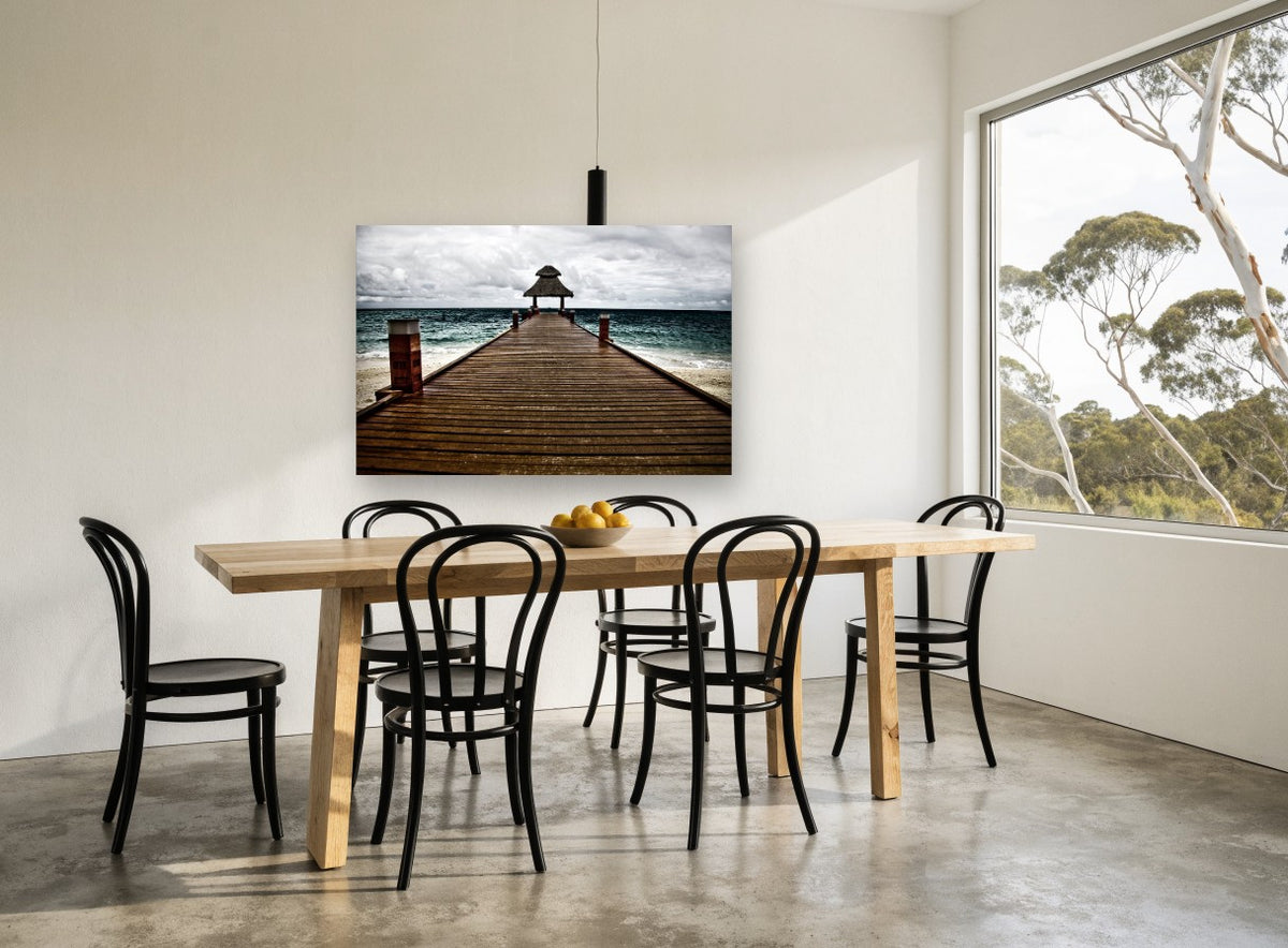 Thatched Jetty Storm coastal canvas print on the wall of a dining room