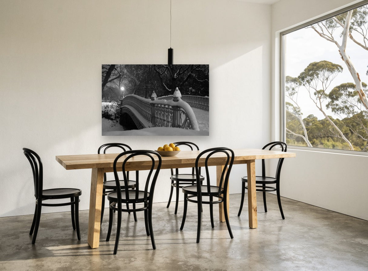 Snowbound Park Bridge city canvas print on the wall of a dining room