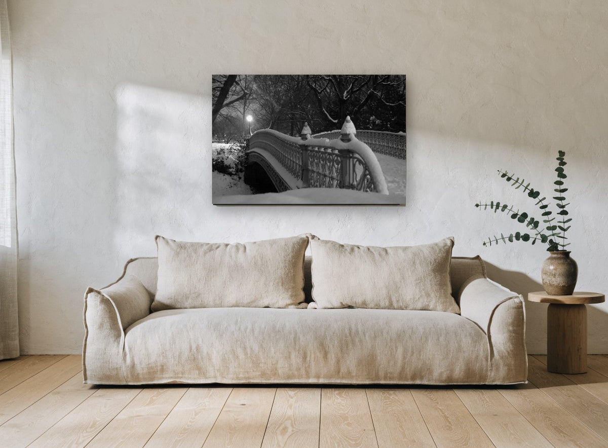 Snowbound Park Bridge city canvas print on the wall of a living room