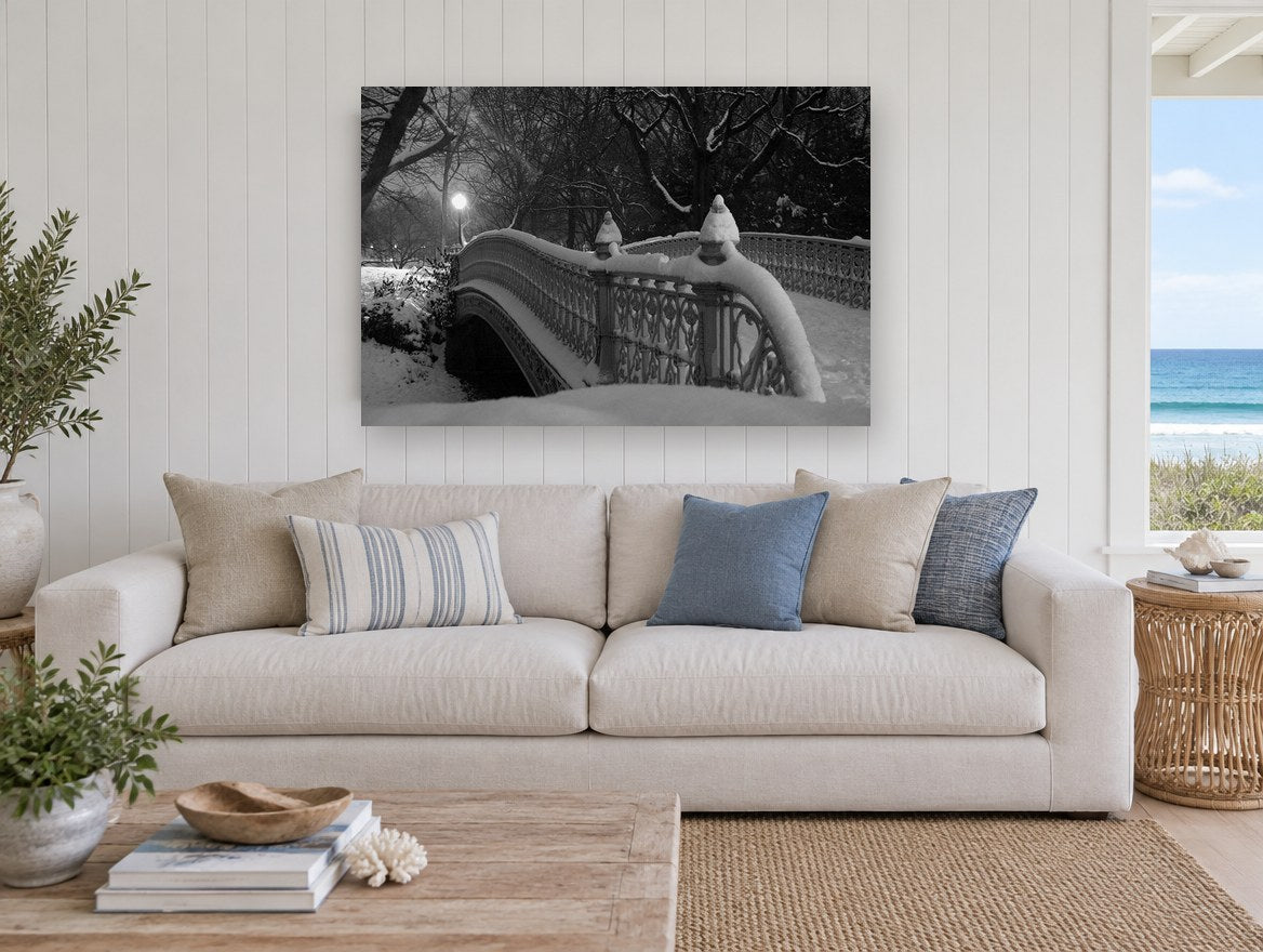 Snowbound Park Bridge city canvas print on the wall of a beach house living room