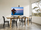 Dusk at the Water Bungalows coastal canvas print on the wall of a dining room