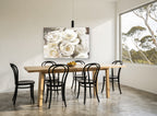 Gilded White Roses floral canvas print on the wall of a dining room