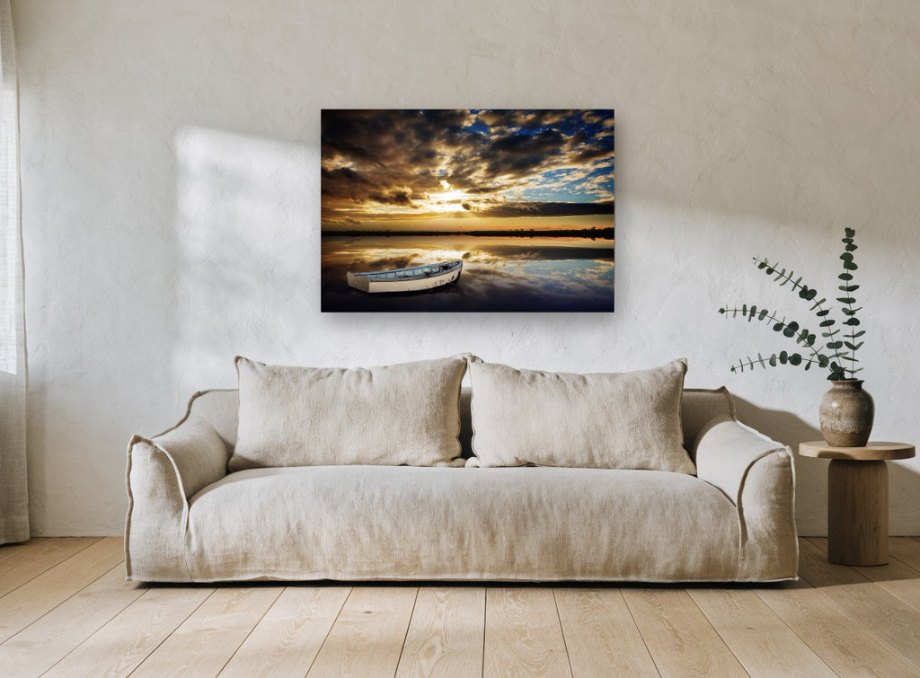 Still Water Dinghy coastal canvas print on the wall of a living room
