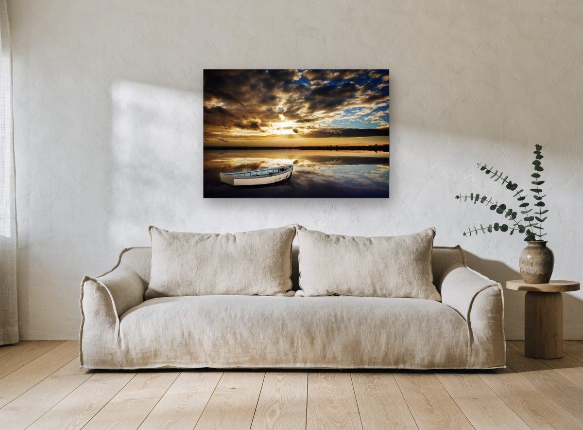 Still Water Dinghy coastal canvas print on the wall of a living room