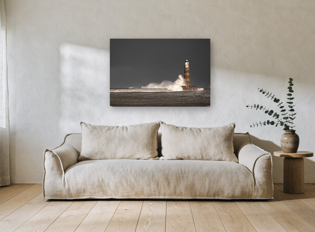 Storm Light Beacon coastal canvas print on the wall of a living room
