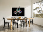 Iridescent Tulip Trio floral canvas print on the wall of a dining room