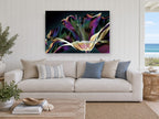 Iridescent Lily Bloom floral canvas print on the wall of a beach house living room