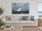 Storm Surge Lighthouse coastal canvas print on the wall of a beach house living room