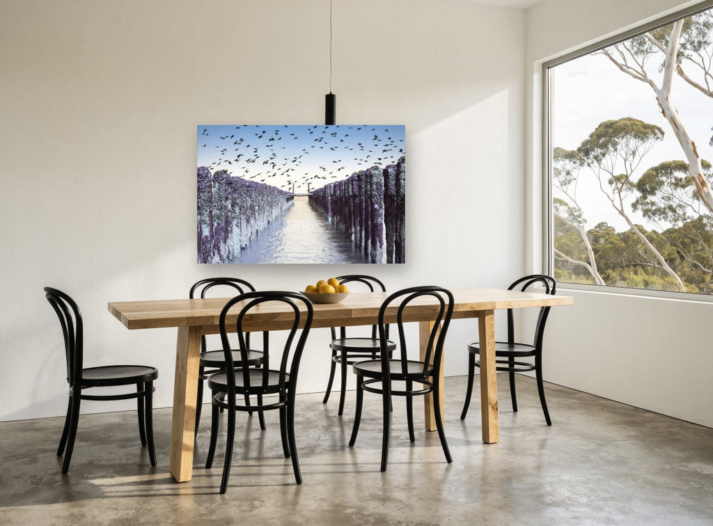 Birds Over Purple Groynes coastal canvas print on the wall of a dining room