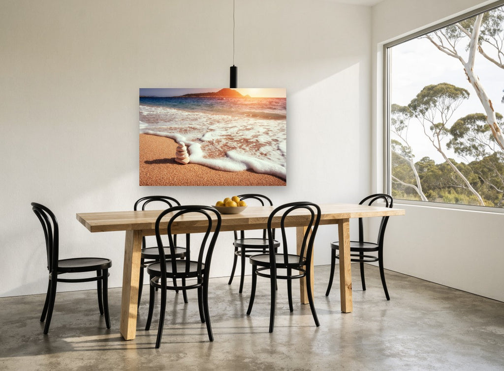 Stacked Stones at Sunset coastal canvas print on the wall of a dining room