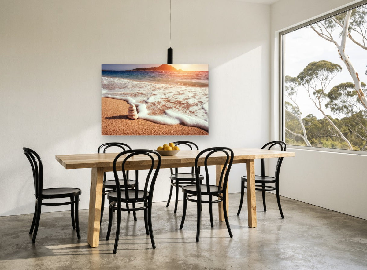 Stacked Stones at Sunset coastal canvas print on the wall of a dining room