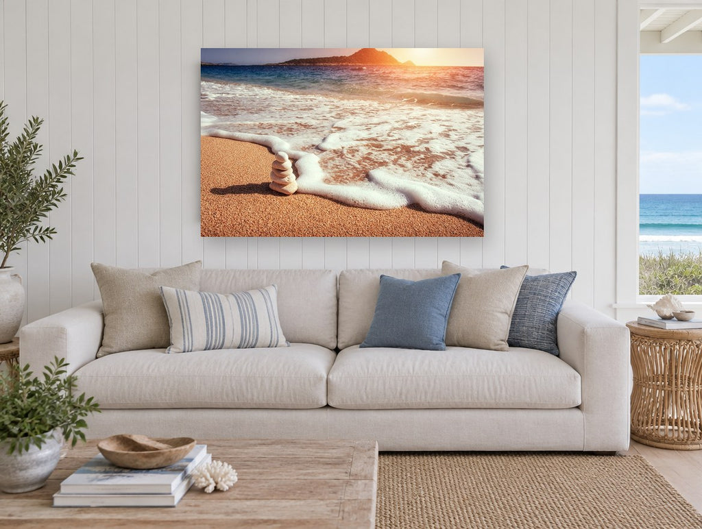 Stacked Stones at Sunset coastal canvas print on the wall of a beach house living room