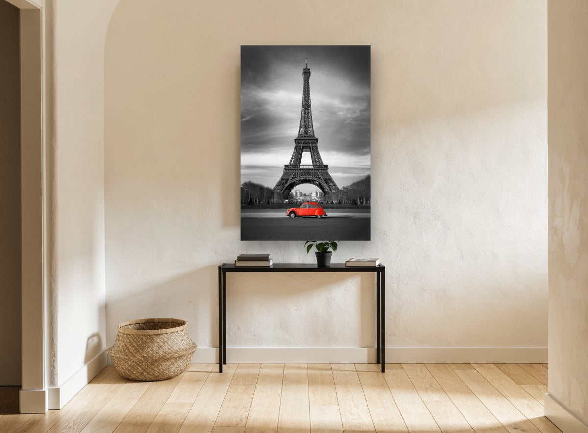 Red Car Below Eiffel city canvas print on the wall of a hallway