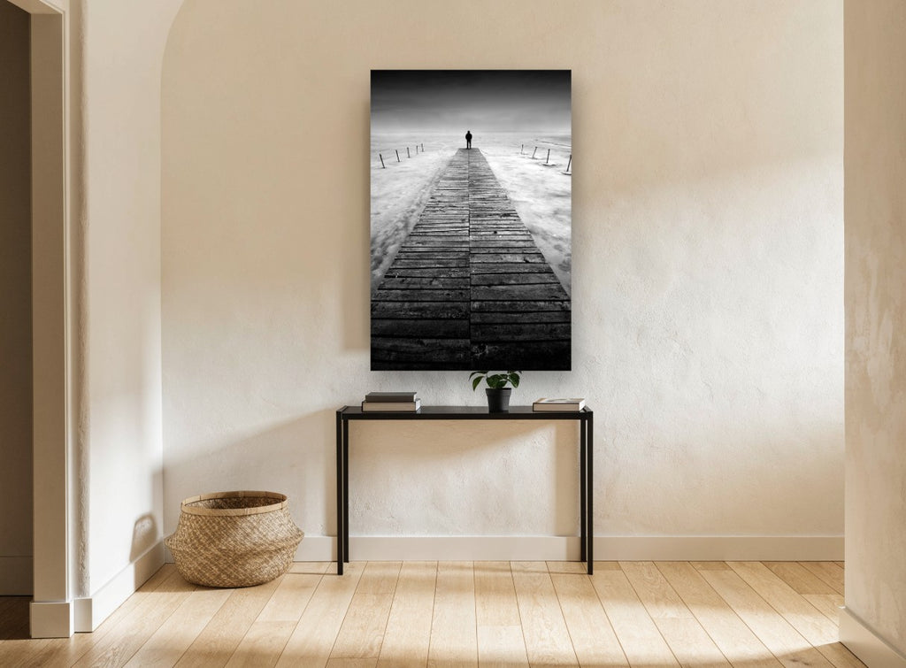 Lone Figure Jetty coastal canvas print on the wall of a hallway