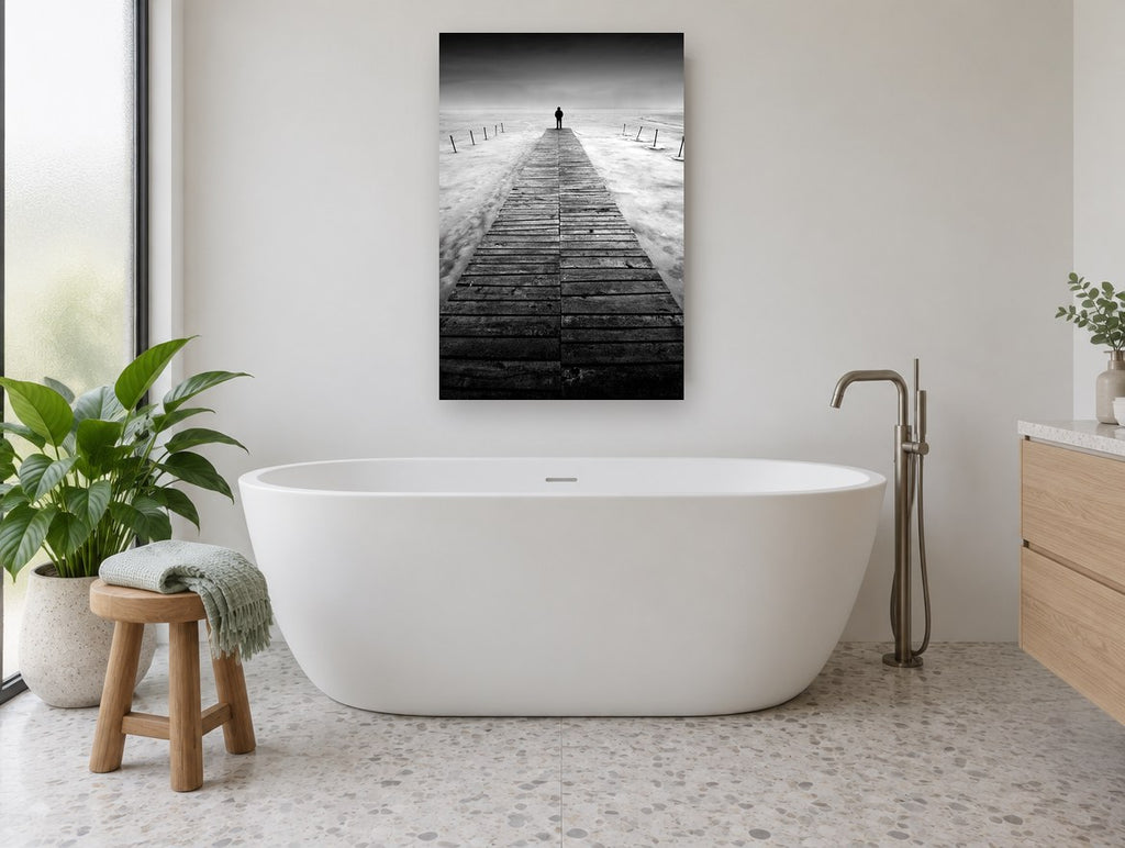 Lone Figure Jetty coastal canvas print on the wall of a bathroom