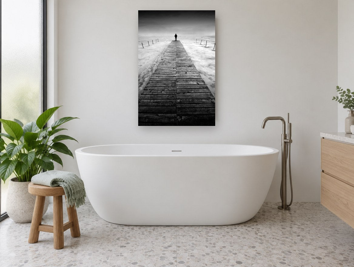 Lone Figure Jetty coastal canvas print on the wall of a bathroom