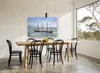 Four Masts in the Swell coastal canvas print on the wall of a dining room