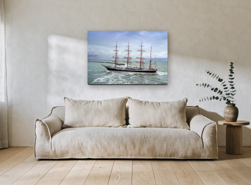 Four Masts in the Swell coastal canvas print on the wall of a living room