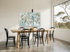 Bluebirds in Blossom floral canvas print on the wall of a dining room