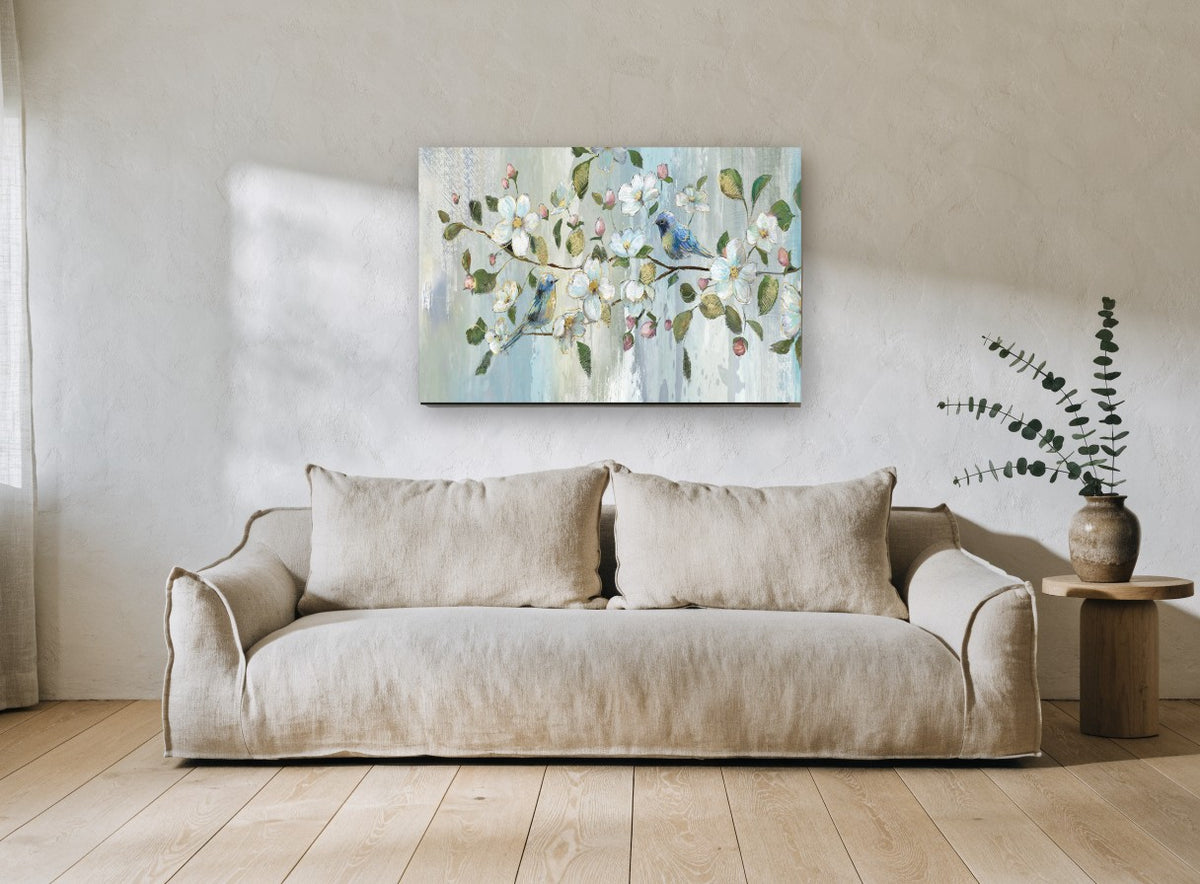 Bluebirds in Blossom floral canvas print on the wall of a living room