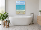 Sandpipers at the Shoreline coastal canvas print on the wall of a bathroom