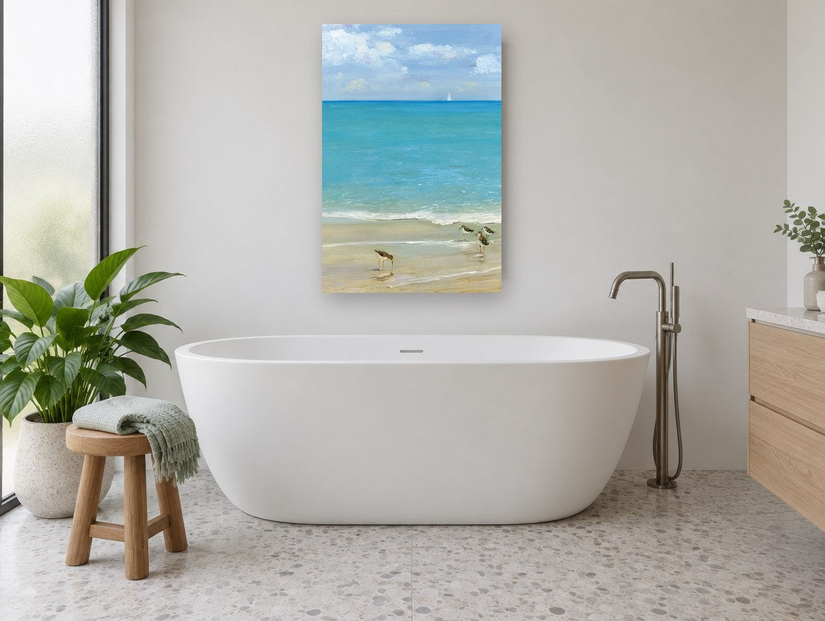 Sandpipers at the Shoreline coastal canvas print on the wall of a bathroom