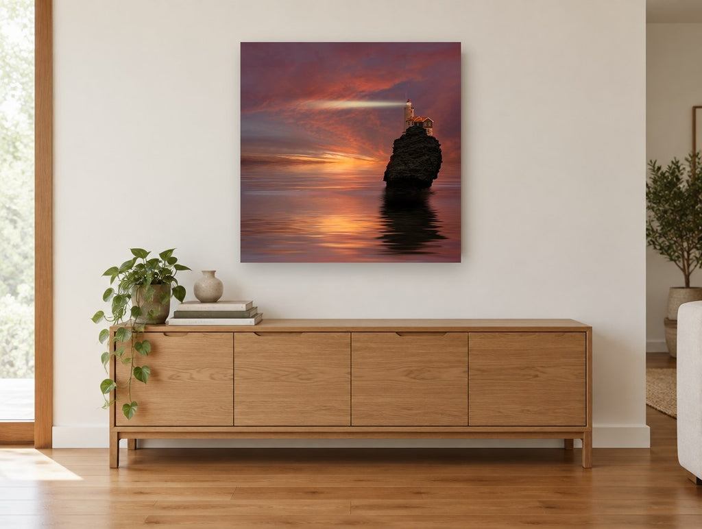 Lighthouse Rock at Dusk landscape canvas print on the wall of a living room above a sideboard