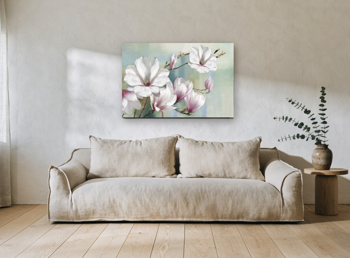 Magnolia Branch in Soft Haze floral canvas print on the wall of a living room