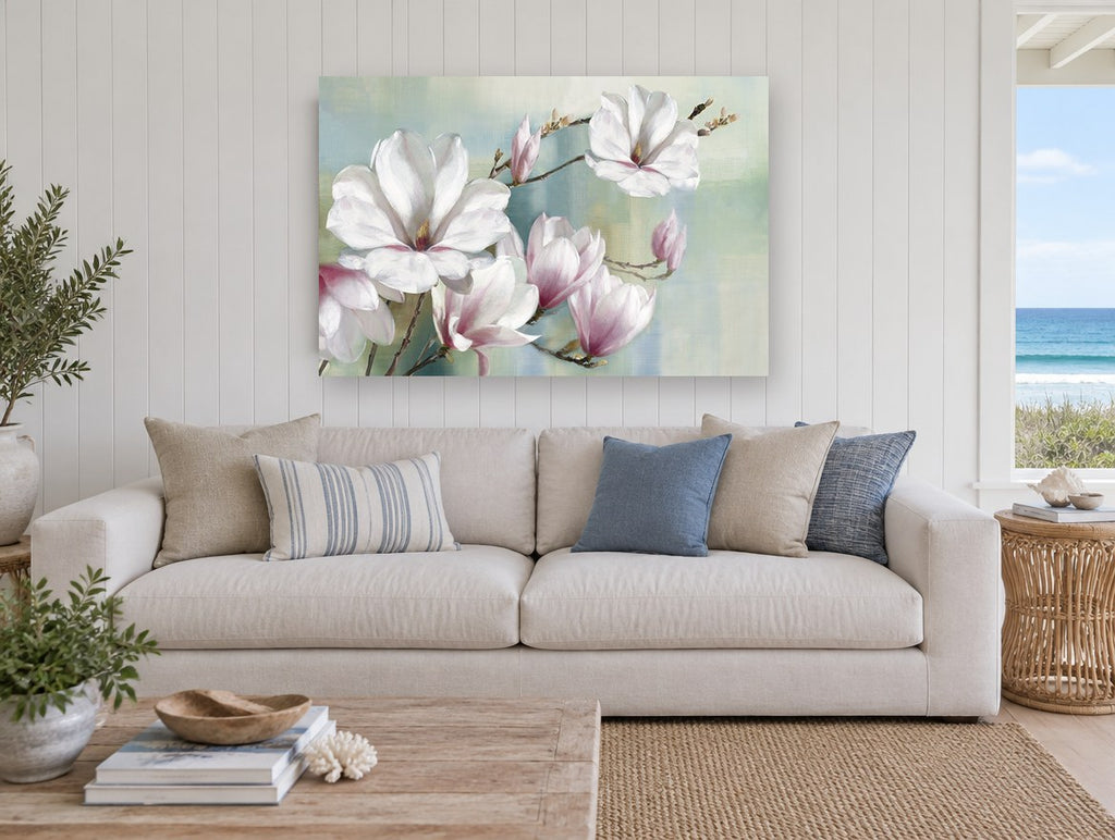 Magnolia Branch in Soft Haze floral canvas print on the wall of a beach house living room