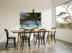 Palm Over the Jetty coastal canvas print on the wall of a dining room