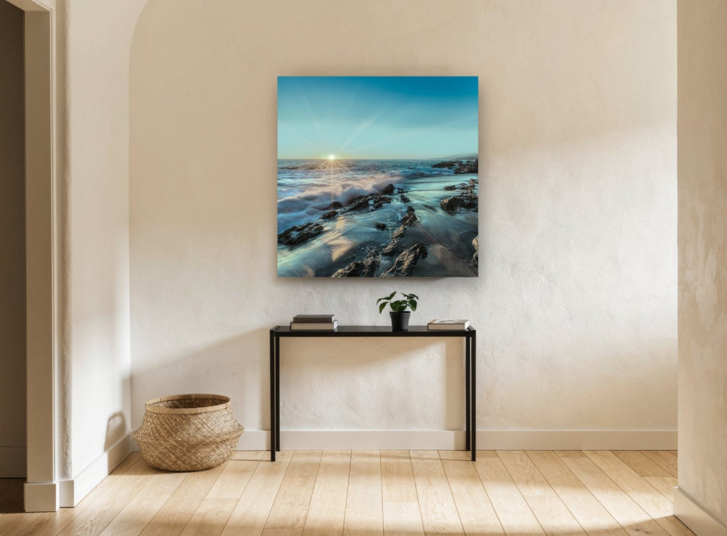 Starburst Over Rocky Shore coastal canvas print on the wall of a hallway