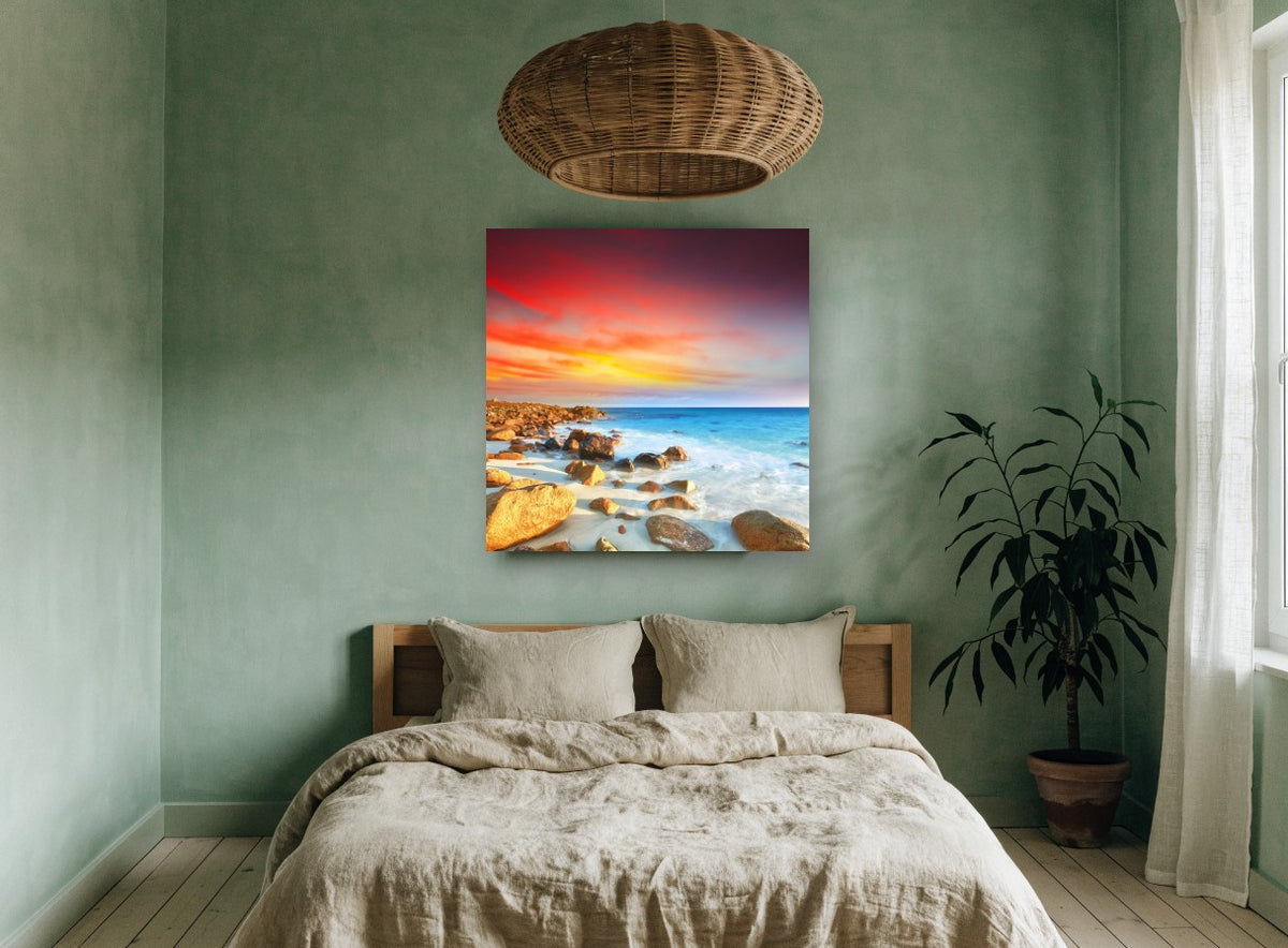 Ember Sky Rocky Cove coastal canvas print on the wall of a bedroom