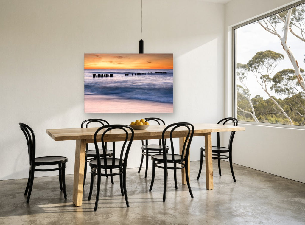 Sunset Pier Posts coastal canvas print on the wall of a dining room
