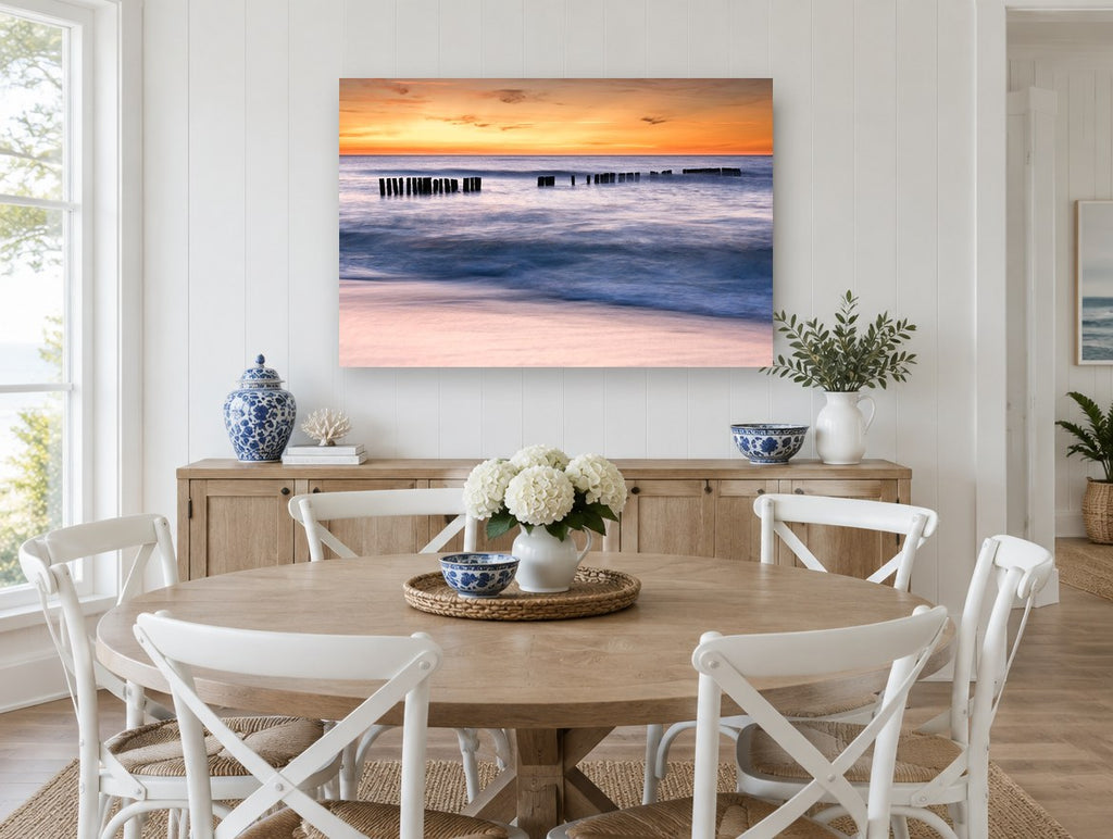 Sunset Pier Posts coastal canvas print on the wall of a Hamptons dining room