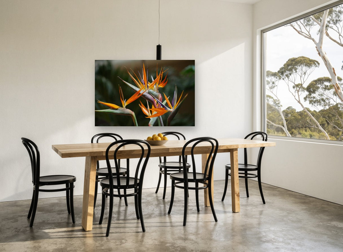 Orange Crane Blooms floral canvas print on the wall of a dining room