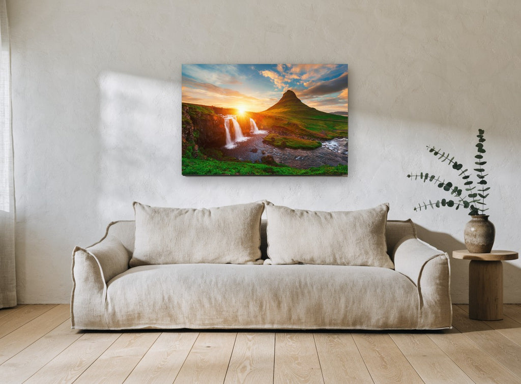 Sunburst Over Waterfall landscape canvas print on the wall of a living room