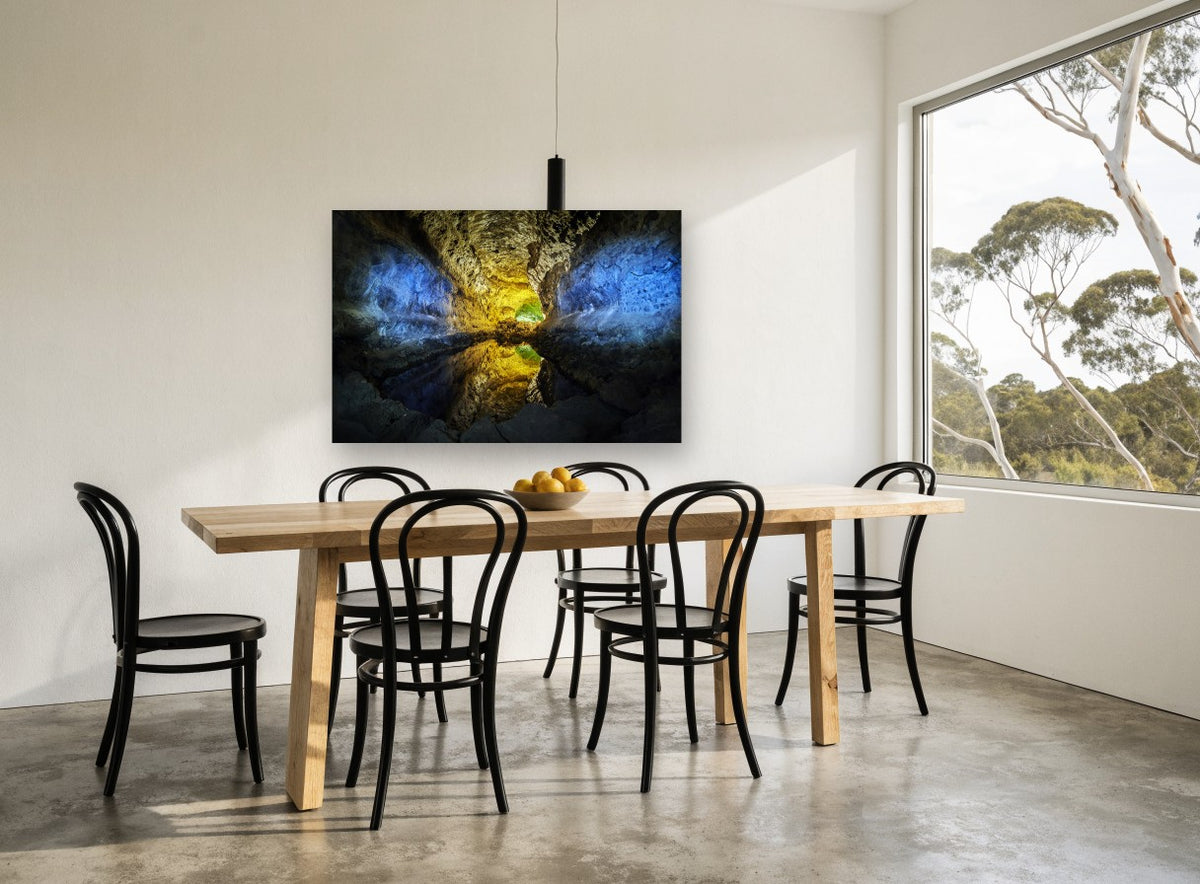 Glowing Cavern Mirror landscape canvas print on the wall of a dining room