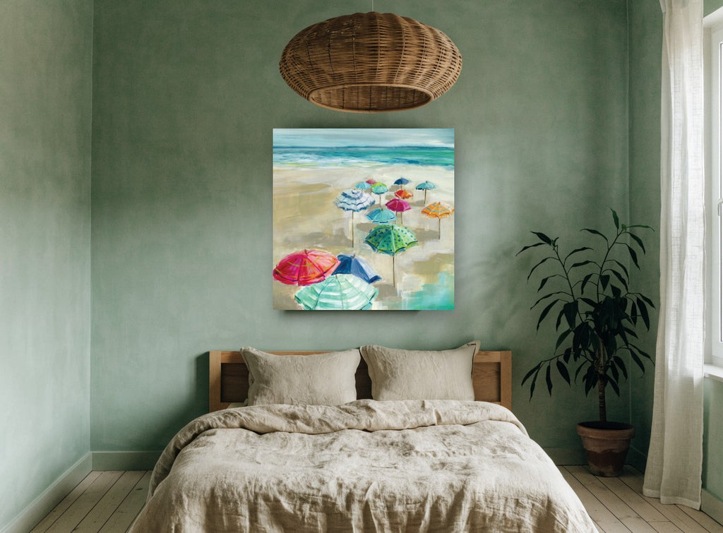 Umbrellas on Sandy Shore coastal canvas print on the wall of a bedroom