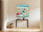 Umbrellas on Sandy Shore coastal canvas print on the wall of a hallway