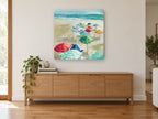 Umbrellas on Sandy Shore coastal canvas print on the wall of a living room above a sideboard