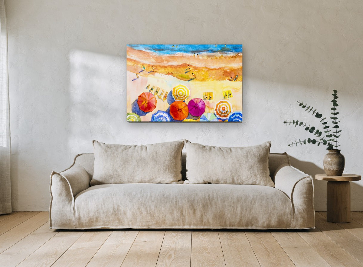 Sunlit Umbrella Shore coastal canvas print on the wall of a living room