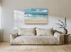Teal Shore Break coastal canvas print on the wall of a living room