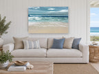 Teal Shore Break coastal canvas print on the wall of a beach house living room
