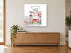 Floral Perfume Flacon floral canvas print on the wall of a living room above a sideboard