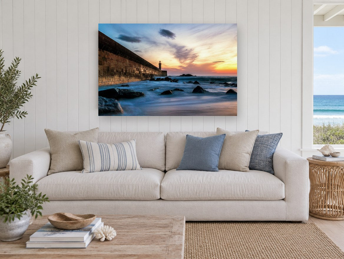 Lighthouse Wall at Dusk coastal canvas print on the wall of a beach house living room