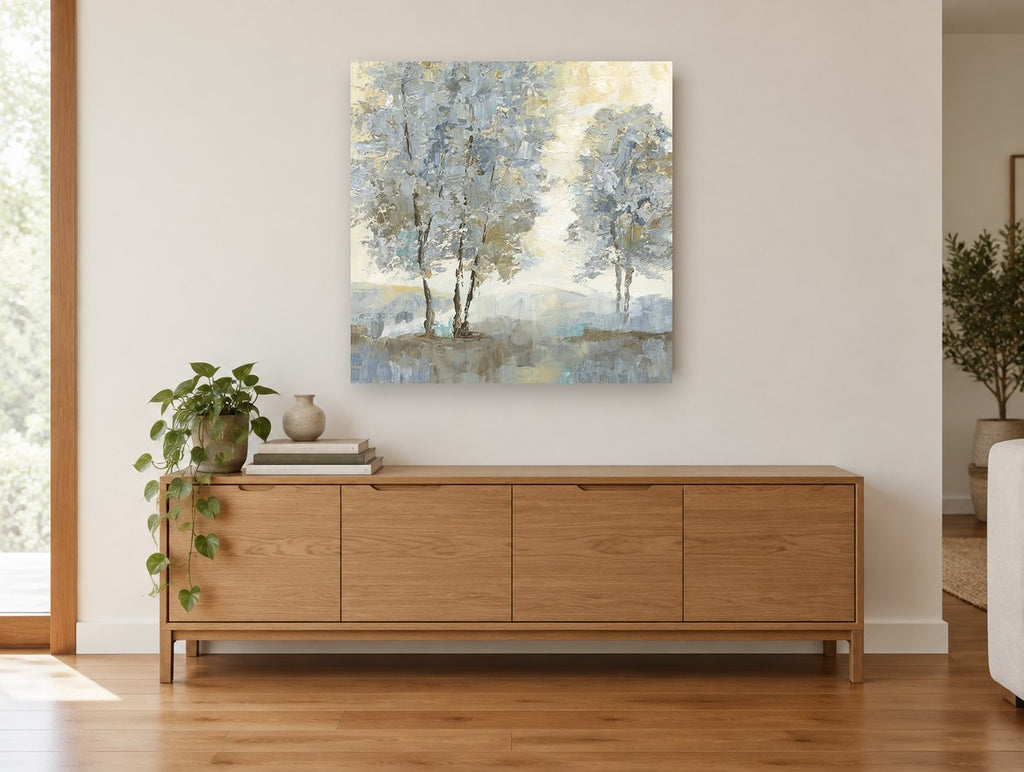 Misty Ochre Birch Grove landscape canvas print on the wall of a living room above a sideboard