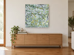 Beech Leaf Canopy landscape canvas print on the wall of a living room above a sideboard