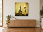 Eiffel Tower and Lamp city canvas print on the wall of a living room above a sideboard