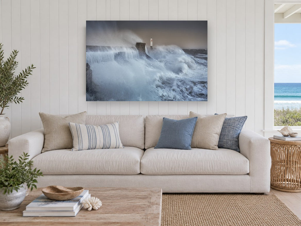 Storm Surge Lighthouse coastal canvas print on the wall of a beach house living room