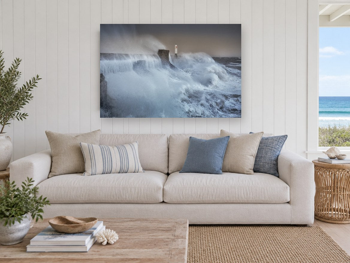 Storm Surge Lighthouse coastal canvas print on the wall of a beach house living room